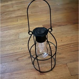 Solar powered hanging metal lantern